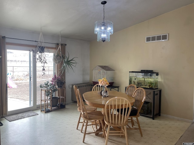 dining space featuring a healthy amount of sunlight, light floors, visible vents, and a chandelier