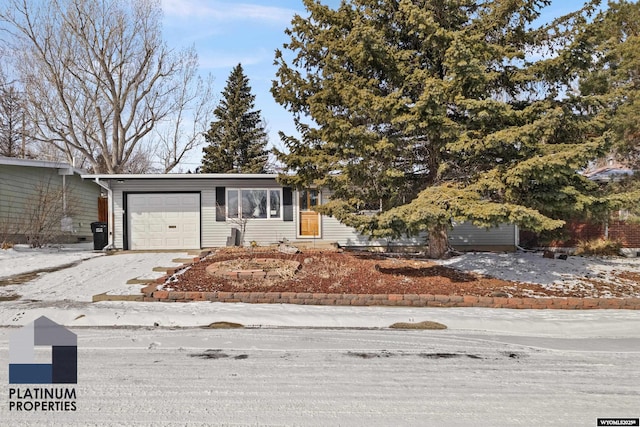 view of front of home with driveway and an attached garage