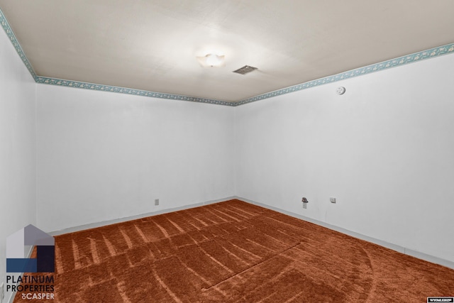 carpeted empty room with visible vents