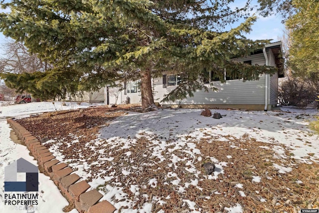 view of snow covered property