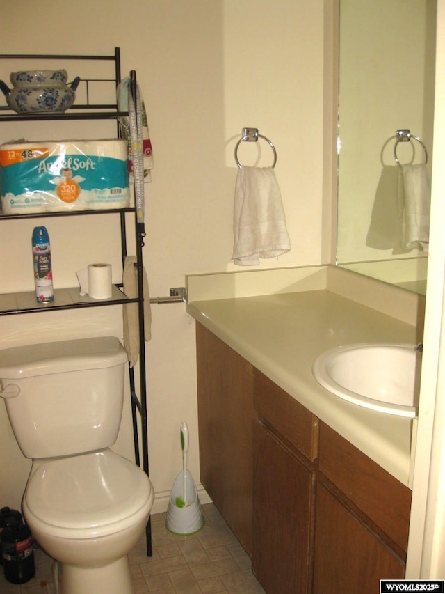 bathroom with toilet and vanity