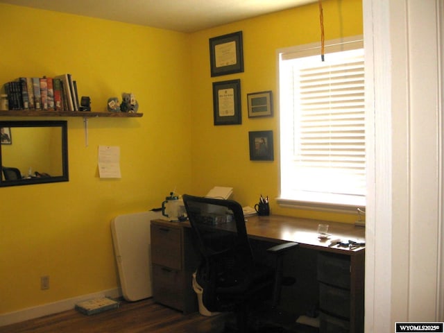 office with baseboards and dark wood-style flooring