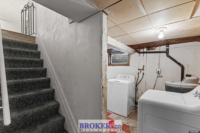 clothes washing area with laundry area and washing machine and clothes dryer