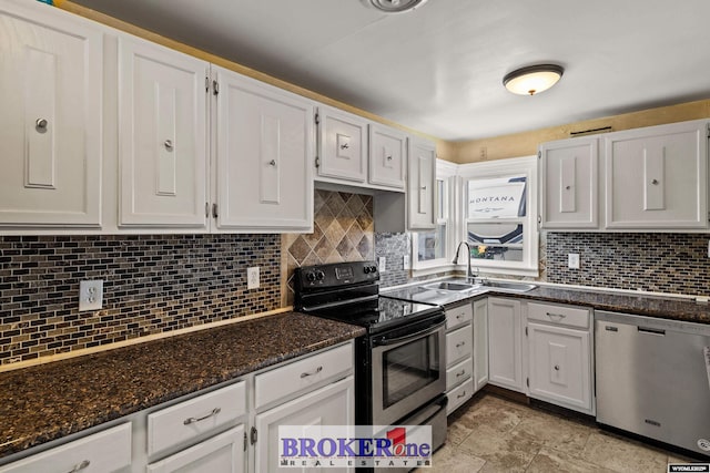 kitchen with backsplash, appliances with stainless steel finishes, white cabinets, and a sink