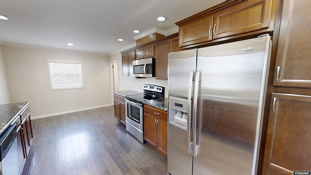 kitchen with brown cabinetry, stainless steel appliances, and crown molding