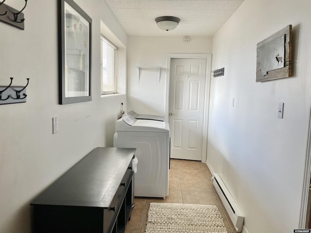 clothes washing area with light tile patterned floors, a baseboard heating unit, laundry area, independent washer and dryer, and baseboards