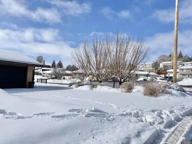 view of yard covered in snow