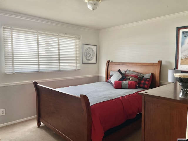 bedroom with light carpet, ornamental molding, and baseboards