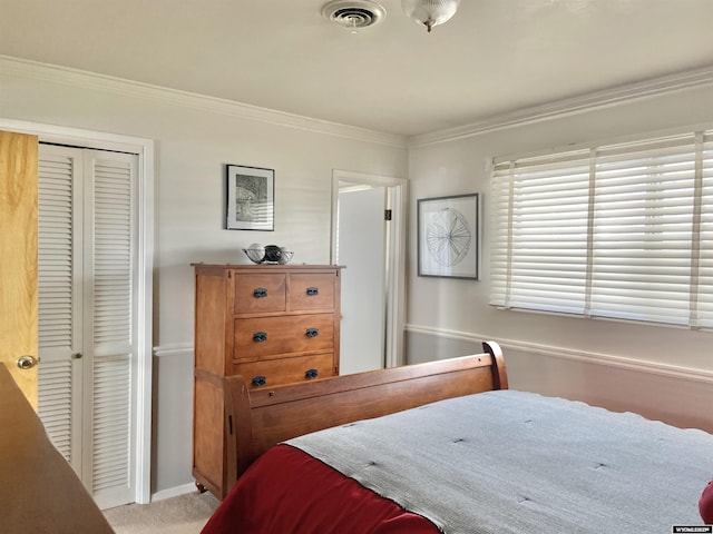 bedroom featuring baseboards, visible vents, light colored carpet, crown molding, and a closet