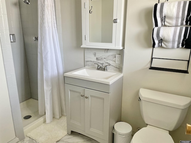 bathroom with marble finish floor, tasteful backsplash, toilet, a shower stall, and vanity