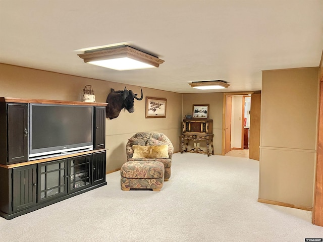 living area with light colored carpet