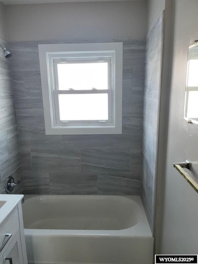 full bath featuring bathing tub / shower combination and vanity