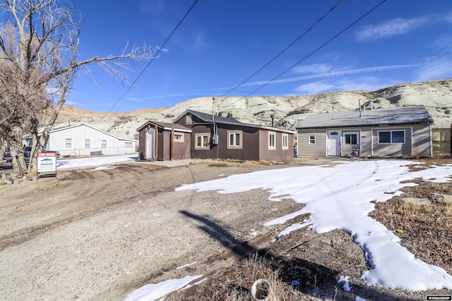 view of front of property with a mountain view