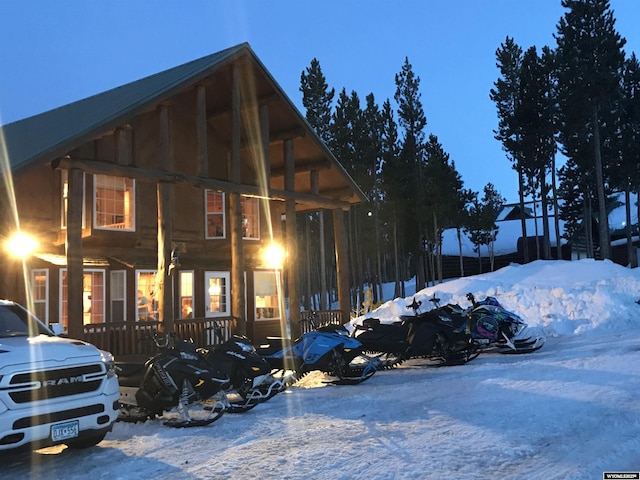 view of snow covered parking area