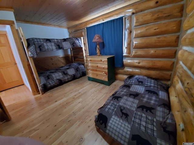 bedroom with wooden ceiling and wood finished floors