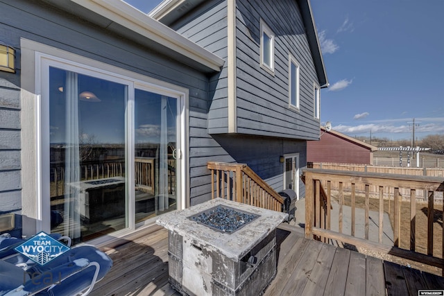 deck with an outdoor fire pit