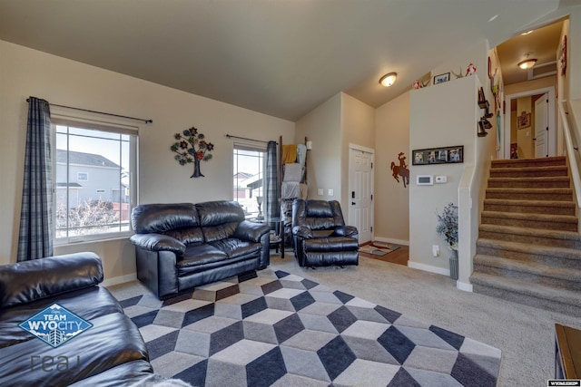 carpeted living area featuring vaulted ceiling, stairway, and baseboards