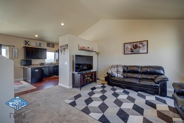 living room with recessed lighting, light carpet, vaulted ceiling, and baseboards