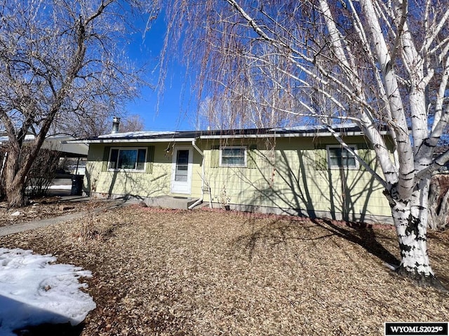 single story home with a carport