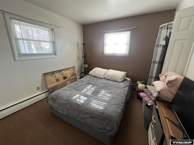 bedroom featuring carpet floors and a baseboard heating unit