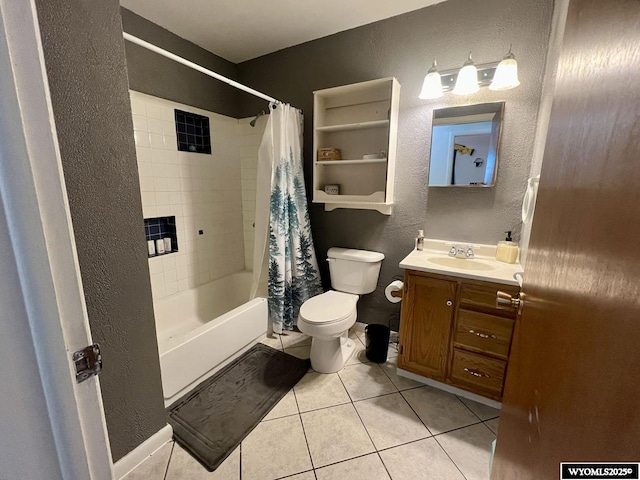 full bathroom with a textured wall, toilet, tile patterned floors, shower / bathtub combination with curtain, and vanity