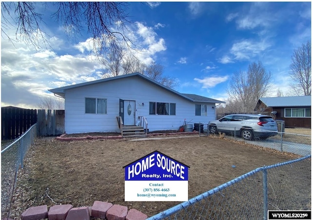 view of front of property with entry steps and fence private yard