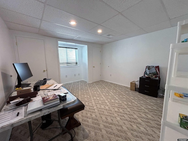 office featuring a paneled ceiling, carpet flooring, baseboards, and recessed lighting