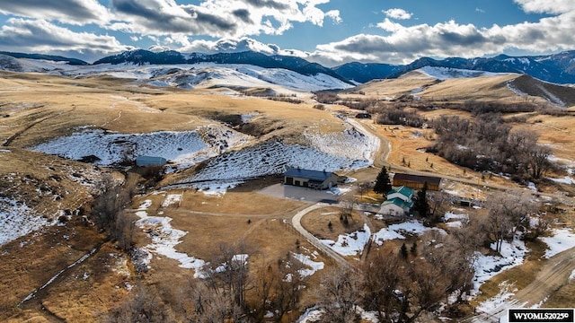 birds eye view of property with a mountain view