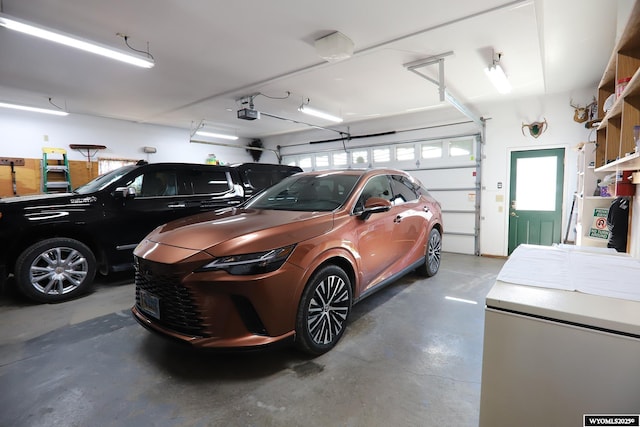 garage with a garage door opener and refrigerator