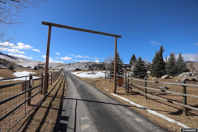 view of road featuring driveway and a mountain view