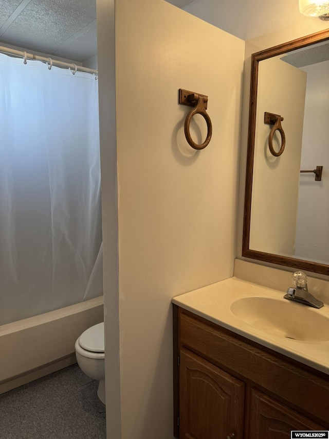 bathroom featuring a textured ceiling, vanity, toilet, and shower / bath combo with shower curtain