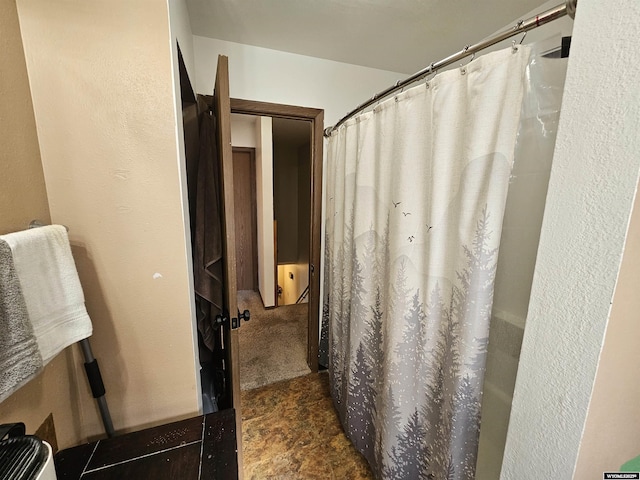 bathroom with a shower with shower curtain