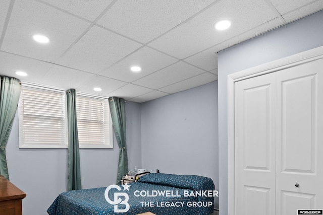 bedroom with recessed lighting and a drop ceiling