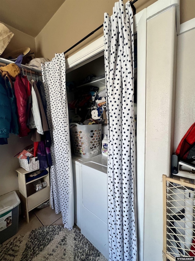 washroom with washer / dryer, laundry area, and tile patterned floors