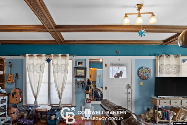 living area featuring beamed ceiling and coffered ceiling