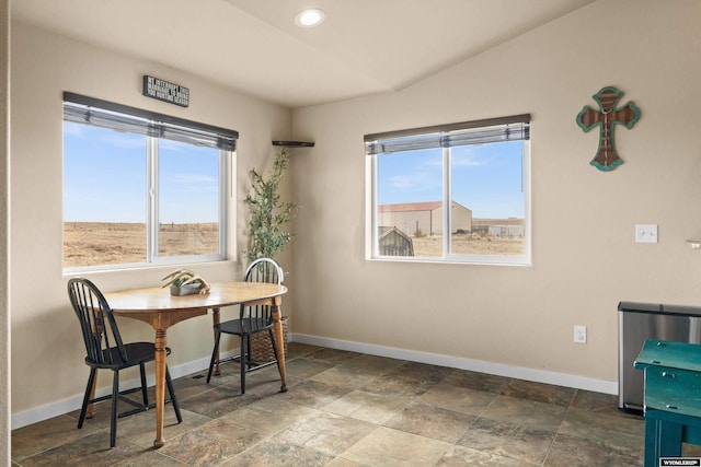 dining room featuring baseboards and a healthy amount of sunlight