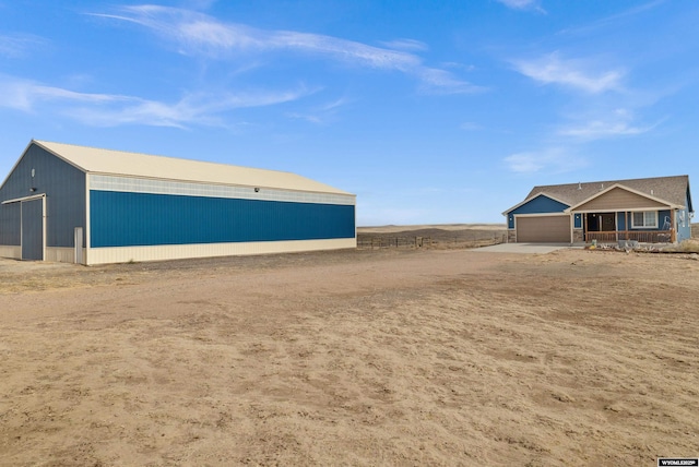 view of yard featuring an outbuilding and a pole building