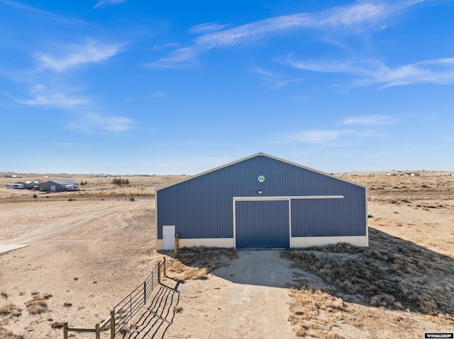 view of pole building with a desert view