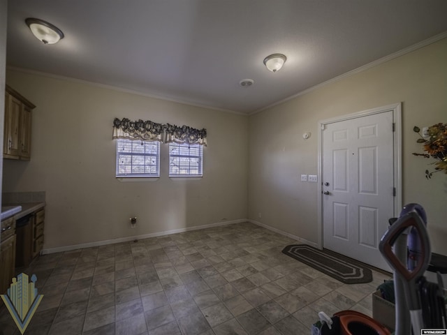 interior space with baseboards and crown molding