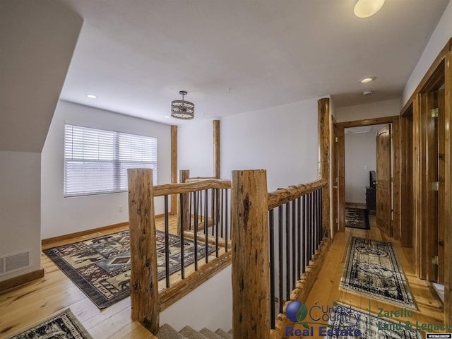 1596 Rd 109, Cheyenne, WY 82009 - corridor featuring baseboards, recessed lighting, an upstairs landing, light wood-style floors, and visible vents