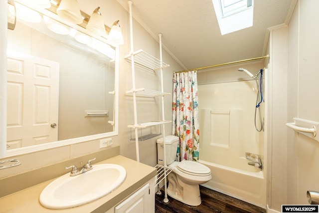 bathroom featuring a textured ceiling, toilet, wood finished floors, vanity, and shower / bath combo