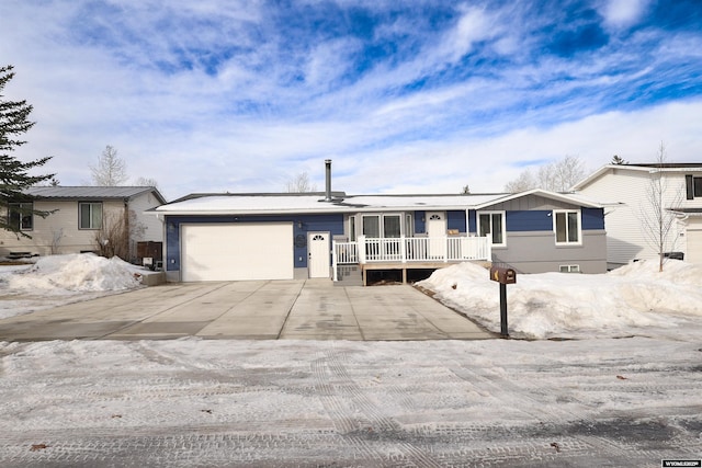 ranch-style home with an attached garage, driveway, and a porch