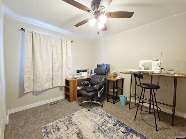 office space with carpet floors, a ceiling fan, visible vents, and baseboards