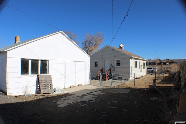 back of property with fence