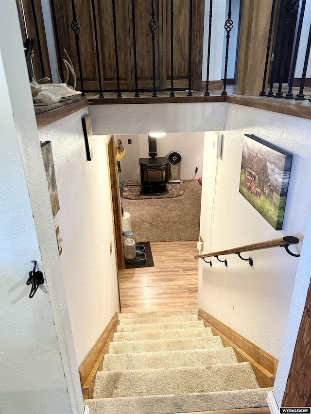 staircase with wood finished floors