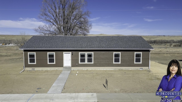 view of front of house featuring crawl space and a shingled roof