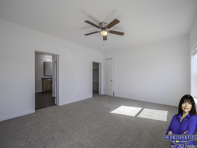 unfurnished bedroom featuring a ceiling fan, carpet flooring, connected bathroom, and baseboards