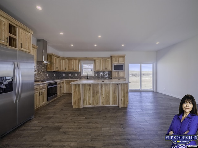 kitchen featuring stainless steel refrigerator with ice dispenser, tasteful backsplash, a sink, oven, and wall chimney exhaust hood