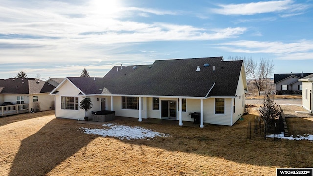 back of property featuring a patio