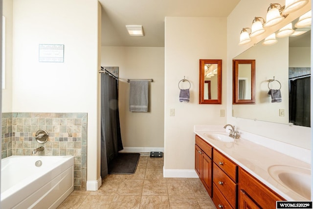 bathroom featuring tile patterned floors, double vanity, a sink, and a bath